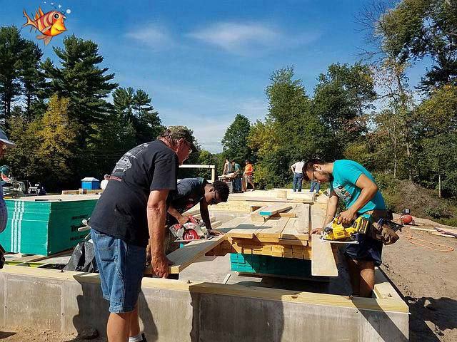 workers cutting wood